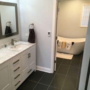 Bathroom remodeling in Schaumburg IL, new flooring, tiles, tub installation, and granite countertops