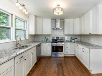 Kitchen Renovation Services and Remodeling Contractor in Lake Barrington; new kitchen hardwood flooring, cabinets, and granite countertops