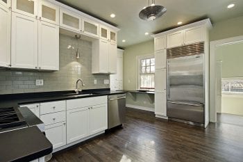 Kitchen in remodeled home with dark wood floors