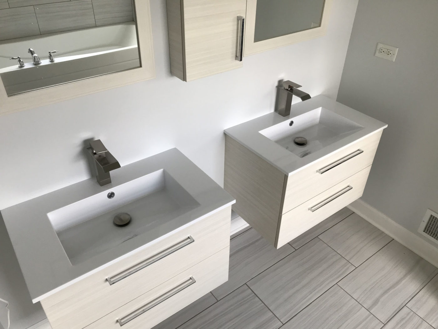 Bathroom Remodeling in Carpentersville - modern sinks recessed mirrors, new flooring