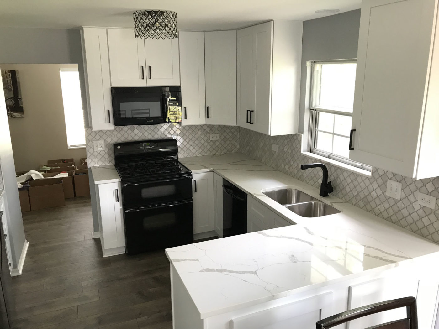 Kitchen Remodeling in Streamwood - black and white color palette, hardwood flooring