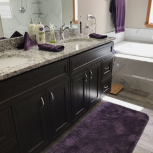 Bathroom Remodeling in Bartlett Illinois: a renovated bathroom with new tub, faucets, cabinets, countertop and more.