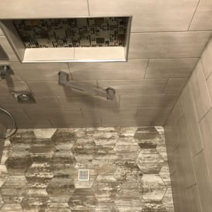 remodeled shower - stone tile