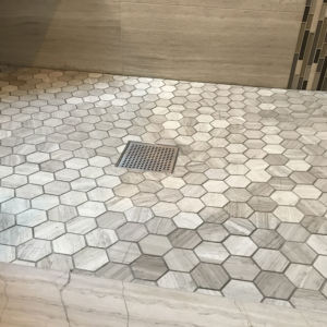 Shower tile installation - hexagon tiles in gray
