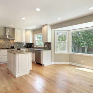 Kitchen in remodeled home with large picture window Kitchen in remodeled home with large picture window - hardwood floor