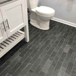 Bathroom remodel in Western Springs IL, new bathroom cabinets and laminate faux-wood tile.